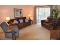 Spacious living room with comfortable seating and plenty of natural light at 511 Rum Run # 33511, Davenport, FL 33897