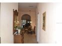 Bright hallway with archways leading to the dining room and living areas at 511 Rum Run # 33511, Davenport, FL 33897
