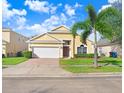 Beautiful one-story house with a well-maintained lawn at 163 Andalusia Loop, Davenport, FL 33837