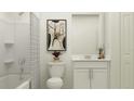 Clean bathroom with white vanity, tub, and shower at 4112 Singing Mockingbird Blvd, Bartow, FL 33830