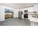 Modern kitchen with stainless steel appliances and granite countertops at 3743 Bergamot St, Lake Alfred, FL 33850