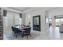 Elegant dining room with modern wood table and six chairs at 1705 Rider Rain Ln, Apopka, FL 32703