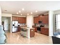 Spacious kitchen with stainless steel appliances and granite countertops at 4552 Sequel Rd, Kissimmee, FL 34746