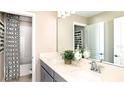 Elegant bathroom with double vanity and a shower/tub combo at 4415 Twisted Twig Bnd, Kissimmee, FL 34746