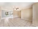 Bright living room with tile floors and a ceiling fan at 3601 Deborah Dr # 3, Lakeland, FL 33810