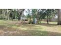 Vacant lot with mature trees and a large grassy area at 242 Oak Hill Rd, Lady Lake, FL 32159