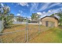 Backyard with chain link fence and storage shed at 312 E Broadway, Fort Meade, FL 33841