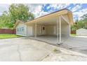 Covered carport with access to home and backyard at 910 N Lincoln Ave, Lakeland, FL 33815