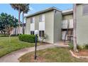 Condo building exterior with walkway and landscaping at 554 Fairways Cir # A, Ocala, FL 34472