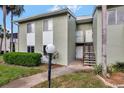 Condo building exterior with walkway and landscaping at 554 Fairways Cir # A, Ocala, FL 34472