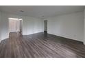 Spacious living room with wood-look floors at 232 Samantha Ave, Auburndale, FL 33823