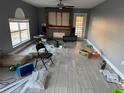 Living room with fireplace and a large window at 5018 Strada Dr, Winter Haven, FL 33880