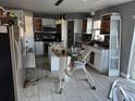 Kitchen with island and white cabinets at 5018 Strada Dr, Winter Haven, FL 33880