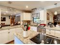 Bright kitchen with granite countertops and stainless steel appliances at 2002 Amesbury Dr, Auburndale, FL 33823