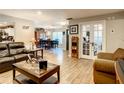Open living room and dining area with hardwood flooring at 2002 Amesbury Dr, Auburndale, FL 33823