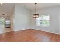 Spacious dining area with hardwood floors and large window at 2572 Berrington Loop, The Villages, FL 32162