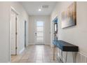 Bright entryway with tile floors and console table at 4550 Narrative Ln, Kissimmee, FL 34746