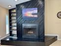 Modern fireplace with built-in shelving at 3234 Bonnybrook S Dr, Lakeland, FL 33811