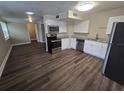 Modern kitchen with stainless steel appliances and ample cabinet space at 1124 Sunshine Ave, Leesburg, FL 34748
