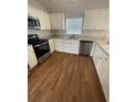 Updated kitchen with stainless steel appliances and granite countertops at 2294 Trailwinds Ter, The Villages, FL 32162