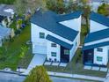 Modern two-story house with white siding and a dark gray accent wall, and a landscaped yard at 716 W 14Th St, Lakeland, FL 33805