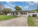 Cute house with a freshly painted exterior and landscaping at 132 James St, Auburndale, FL 33823
