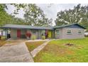 Newly renovated home with a carport and storage shed at 554 Ralph St, Auburndale, FL 33823