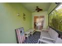 Relaxing screened porch with seating and a game at 1111 Royal Ridge Dr, Davenport, FL 33896