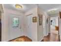 Bright entryway with tile flooring, built-in storage, and stained-glass door at 439 San Jose Dr, Winter Haven, FL 33884