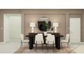 Elegant dining room featuring a black table, white chairs, and a statement mirror at 760 Terrapin Dr, Debary, FL 32713