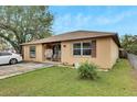 Cozy one-story home with a neatly kept lawn at 1375 6 Iron Dr, Lakeland, FL 33801