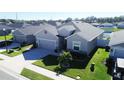 Nice curb appeal of the house with a view of the neighborhood at 6855 Mossy Oak Ln, Lakeland, FL 33810