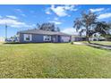 Cute blue house with a spacious yard, great curb appeal at 2986 Sw 143Rd Place Rd, Ocala, FL 34473