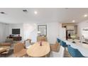 Bright dining area with light wood table and seating for six at 5778 Meditation Dr, Clermont, FL 34714