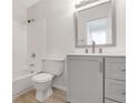 Updated bathroom with grey vanity, new fixtures, and stylish mirror at 7340 Daniel Webster Dr # 6, Winter Park, FL 32792