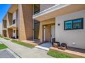 Modern townhome with light brown and beige facade at 7482 Brooklyn Dr, Kissimmee, FL 34747