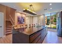 Modern kitchen with dark wood cabinets and large island at 7482 Brooklyn Dr, Kissimmee, FL 34747