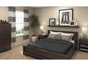 Spacious bedroom with dark wood furniture and neutral wall decor at 2651 Candied Apple Aly, Kissimmee, FL 34744