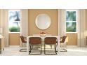 Bright dining room with a neutral color scheme, a square table, and four brown chairs at 3035 Chantilly Dr, Davenport, FL 33837