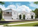Four-unit townhome building with attached garages and front yards at 3848 King Hill Dr, Haines City, FL 33844