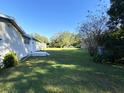 Large backyard with grassy area at 4805 Sand Mountain Loop Rd, Auburndale, FL 33823