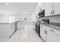 Modern kitchen with granite countertops and stainless steel appliances at 2162 Hadley Rd, Bartow, FL 33830