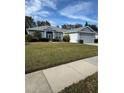 Landscaped yard and single story house at 3323 Songbird Ln, Lakeland, FL 33811