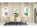 Bright dining room with a light wood table and white chairs at 7018 Rosy Sky Ave, Orlando, FL 32829