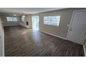 Bright living room features a fireplace and laminate wood floors at 5716 Deerfield Rd, Orlando, FL 32808