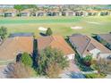 Community view with golf course and houses at 1369 Palmetto Dunes St, Davenport, FL 33896