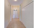 Bright entryway with tile flooring and coat closet at 1369 Palmetto Dunes St, Davenport, FL 33896