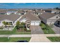 Modern single-Gathering homes in a planned community with landscaped yards and paver driveways at 1767 Bee Nice Dr, Kissimmee, FL 34744