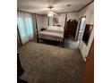 Spacious main bedroom with a post bed and ample floor space at 4427 Dove Meadow Ln, Lakeland, FL 33810