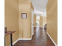 Bright and spacious entryway with hardwood floors and view to the living room at 1771 Turtle Rock Dr, Lakeland, FL 33803